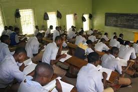 A cross-section of students writing an examination