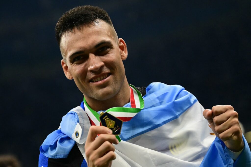 Inter Milan's Argentine forward #10 Lautaro Martinez poses with his medal during the trophy ceremony for the Italian Champions following the Italian Serie A football match between Inter Milan and Lazio in Milan, on May 19, 2024. Inter celebrates his 20th Scudetto. (Photo by Marco BERTORELLO / AFP)