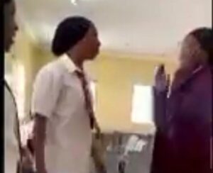 The victim being slapped by her classmate. Credit | X-@mooyeeeeeee