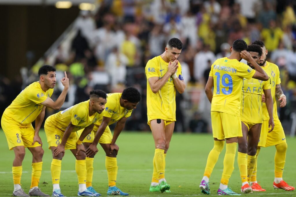 Nassr's players react in the penalty shootout during the King's Cup final match between Al-Nassr and Al-Hilal at the King Abdullah Sport City Stadium in Jeddah on May 31, 2024. (Photo by AFP)