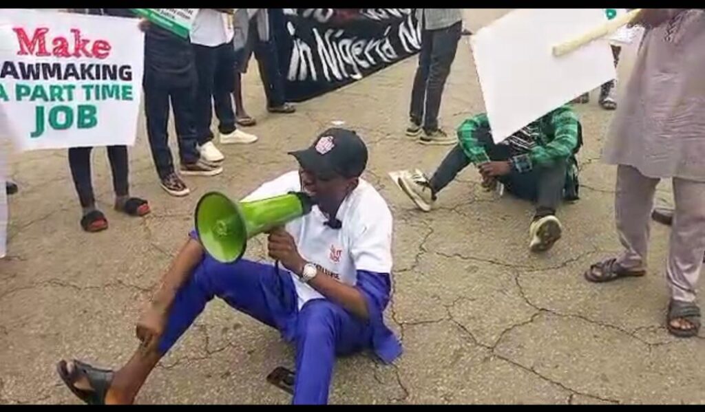 One of the protesters speaking at MKO Abiola Stadium, Abuja on Thursday. CREDIT: Solomon Odeniyi.